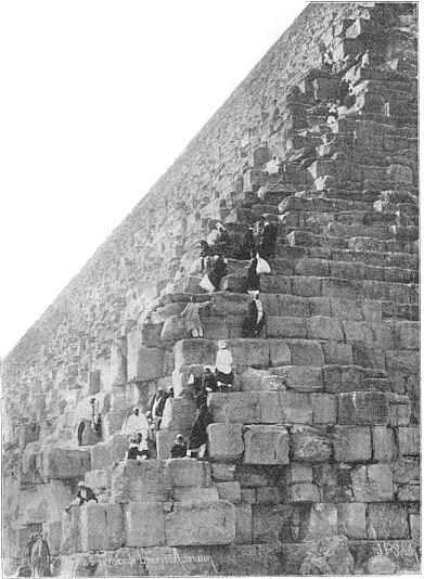 Tourists climbing the pyramid