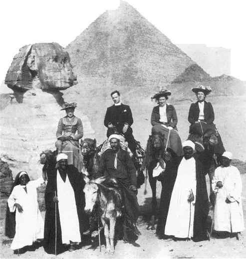 Group of people in front of Sphinx and Pyramid